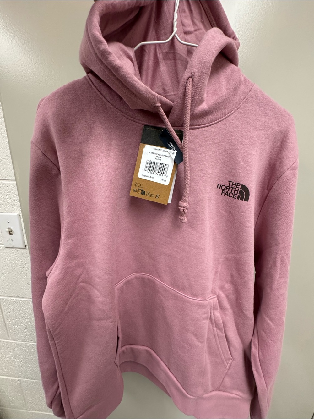 The North Face pink hoodie with mountain graphic / Women’s Medium Retails $70